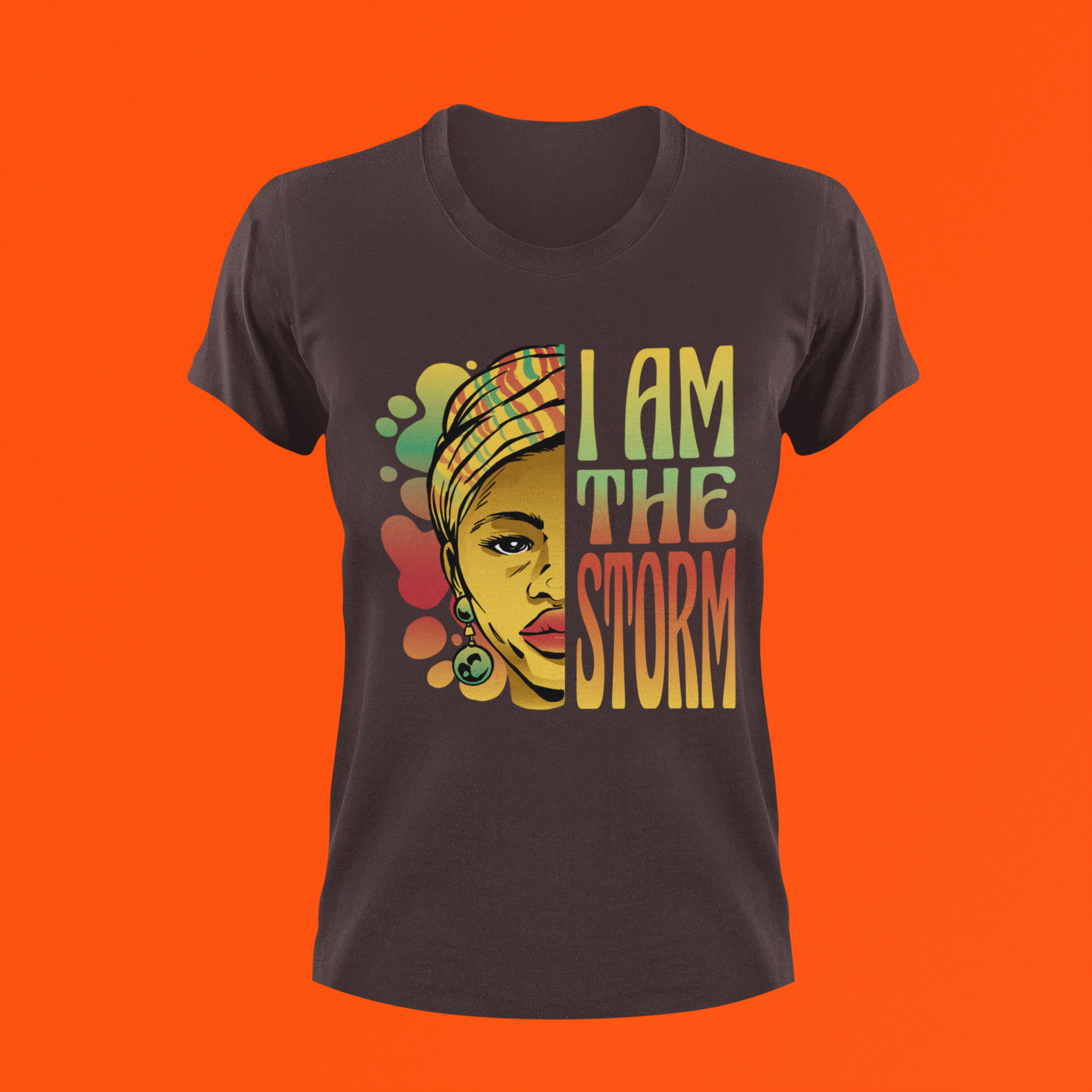Dark brown short-sleeve T-shirt with front portrait graphic and “I AM THE STORM” text