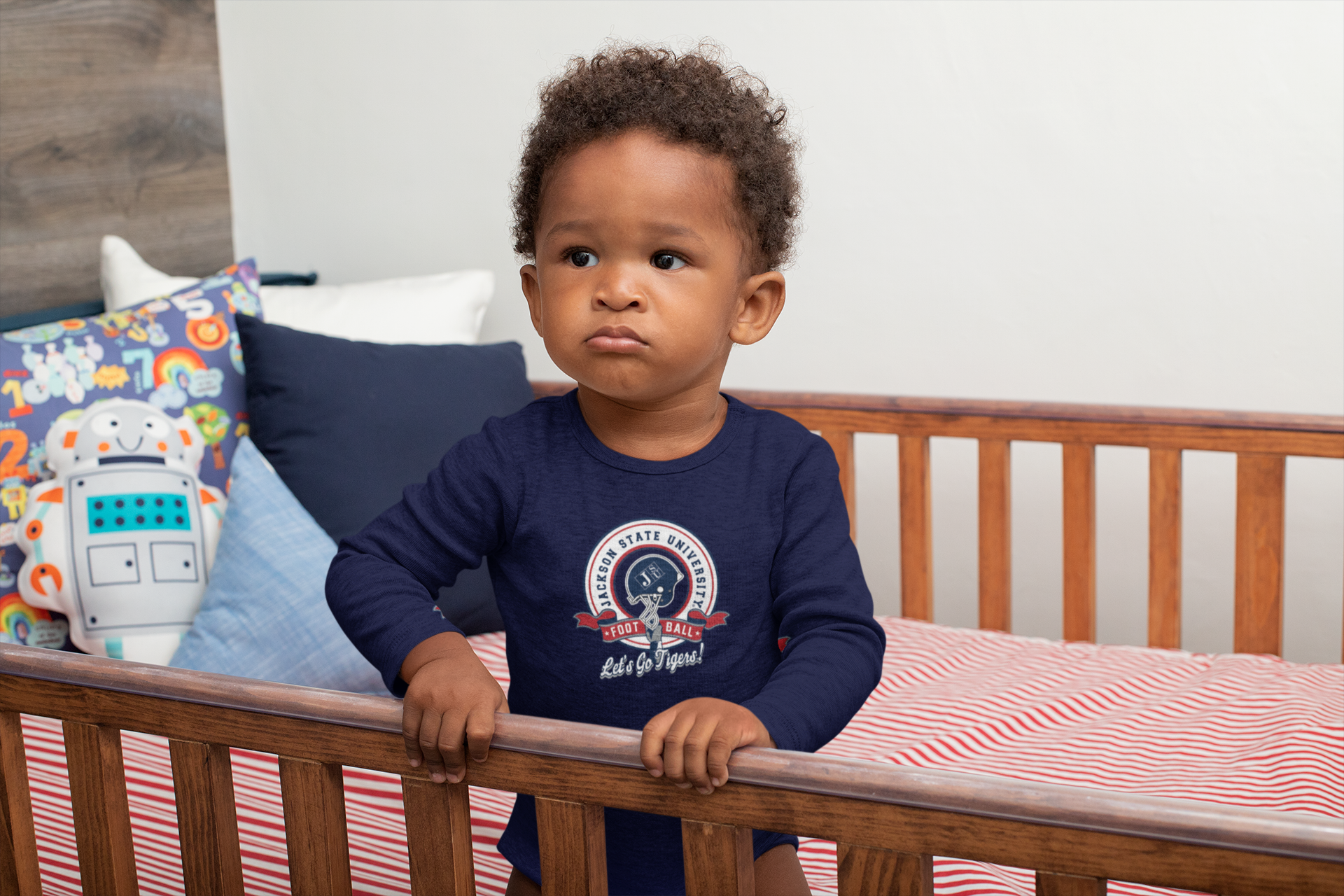 Infant long sleeve bodysuit, navy blue with round college logo graphic on chest