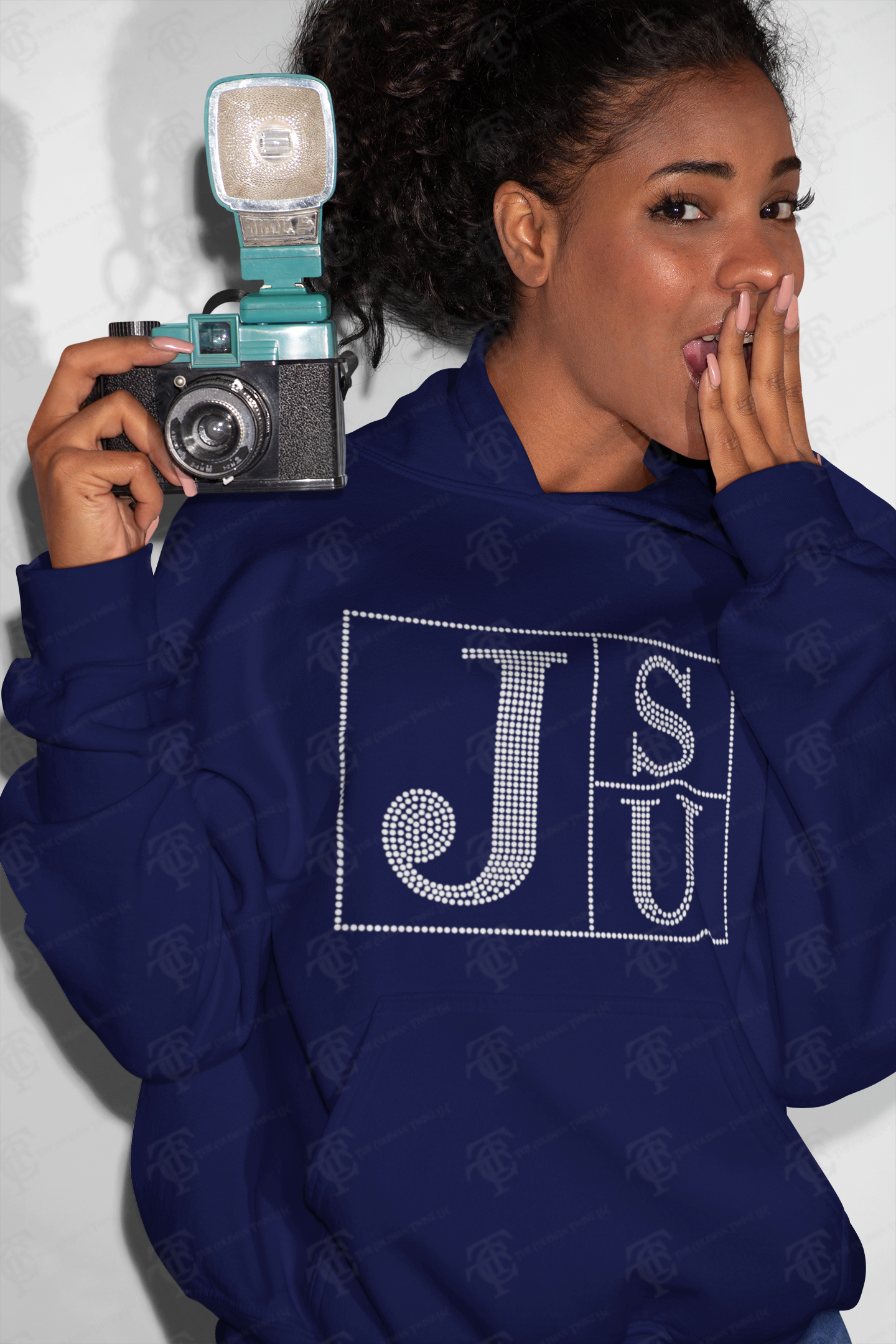 Navy rhinestone JSU block-letter pullover hoodie worn by model, hood and pouch visible