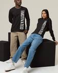 Black unisex crew neck long sleeve T-shirt with white front and sleeve text