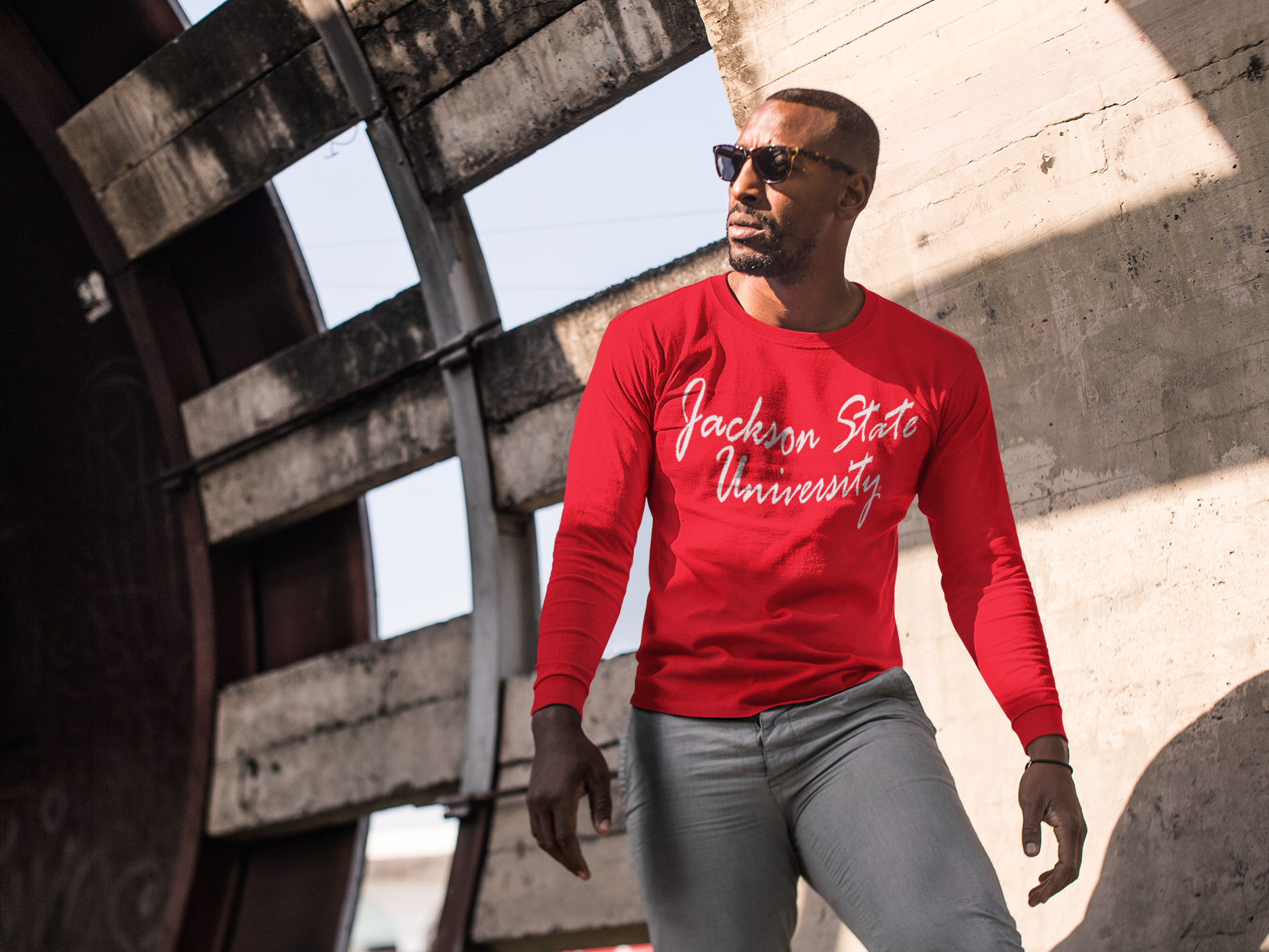 Red long-sleeve crewneck T-shirt with white script logo across chest