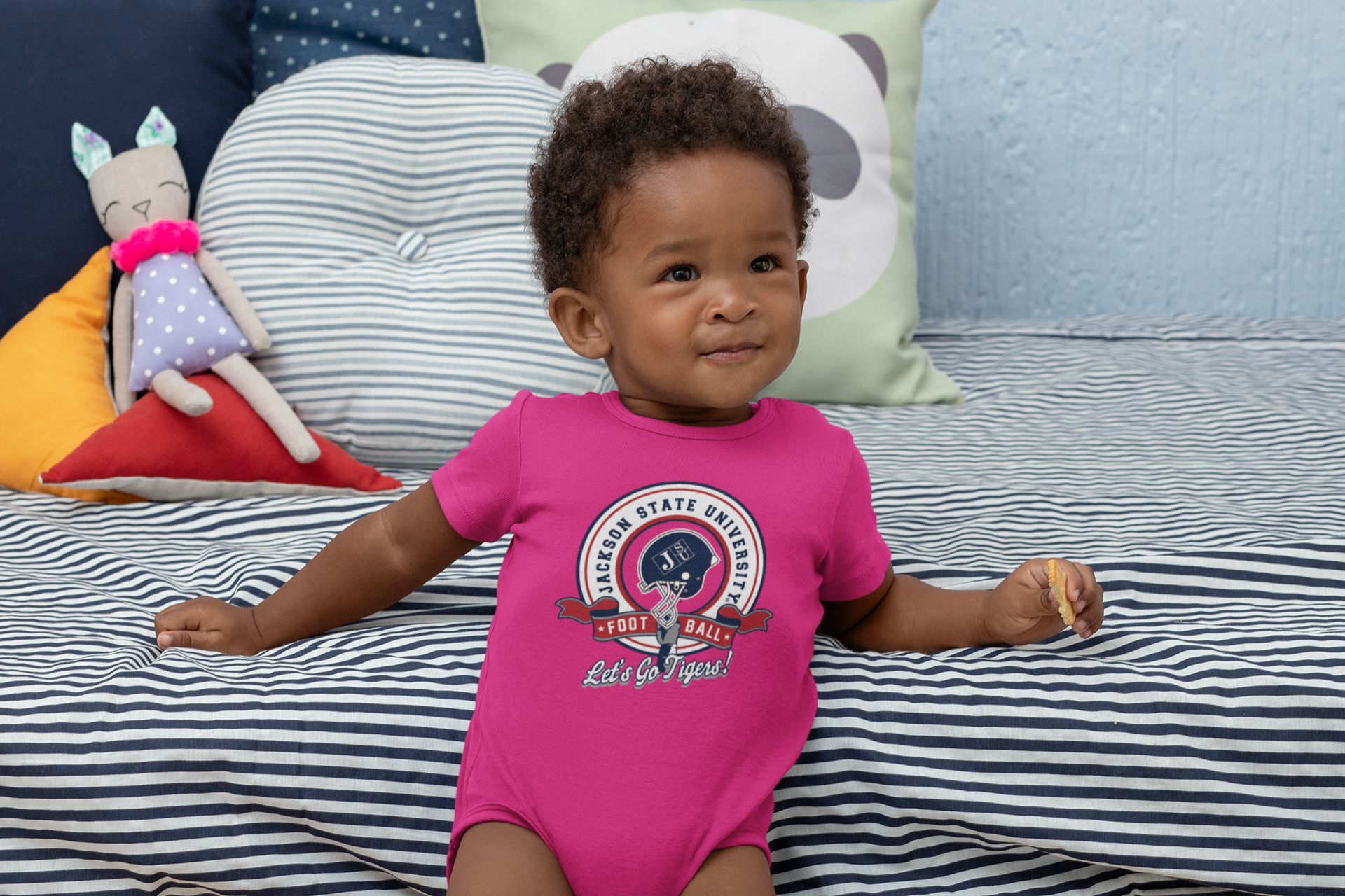 Pink infant short-sleeve bodysuit with circular sports logo, snap legs