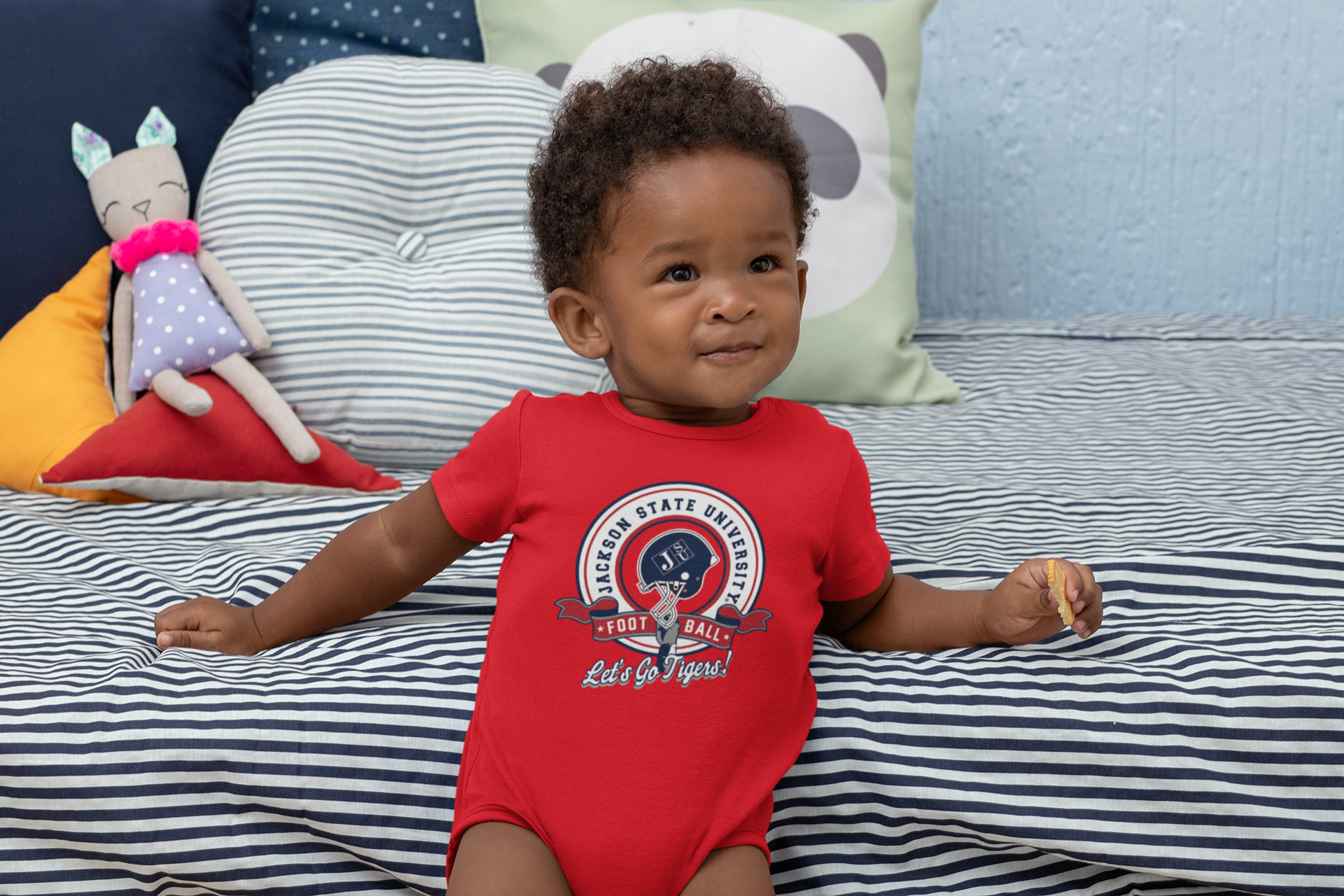 Red infant short-sleeve bodysuit with circular sports logo, snap legs