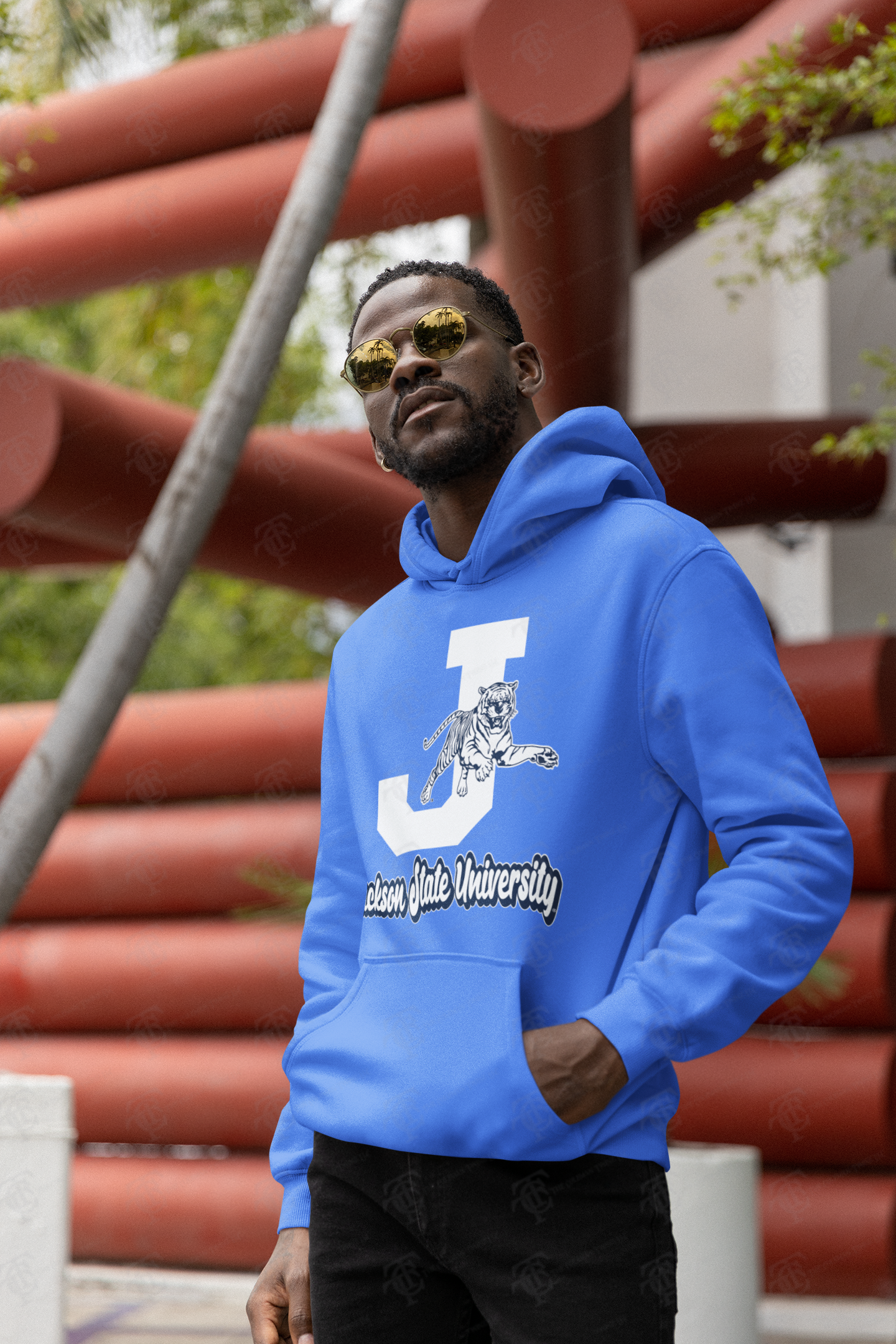 Blue pullover hoodie on person with white J and leaping tiger graphic on front