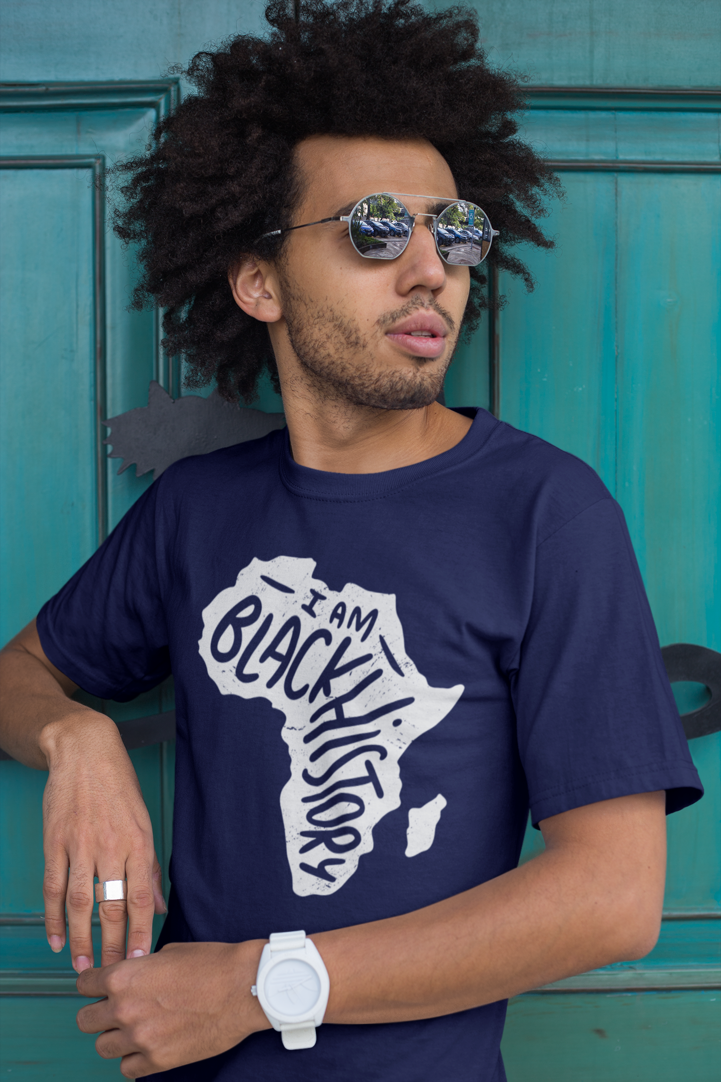 Navy short-sleeve T-shirt with white 'I Am Black History' map graphic, model wearing