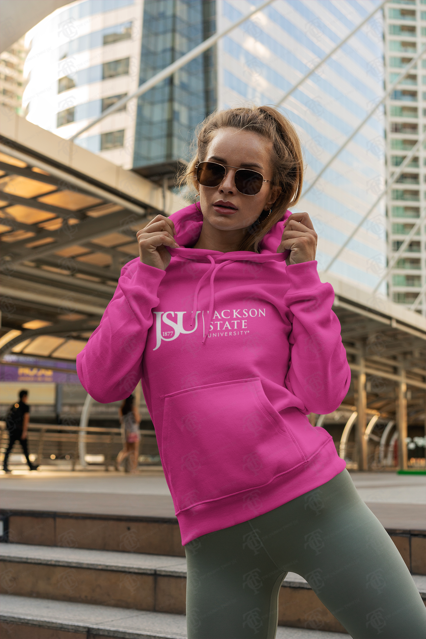 Pink pullover hoodie on model with front kangaroo pocket and Jackson State logo graphic