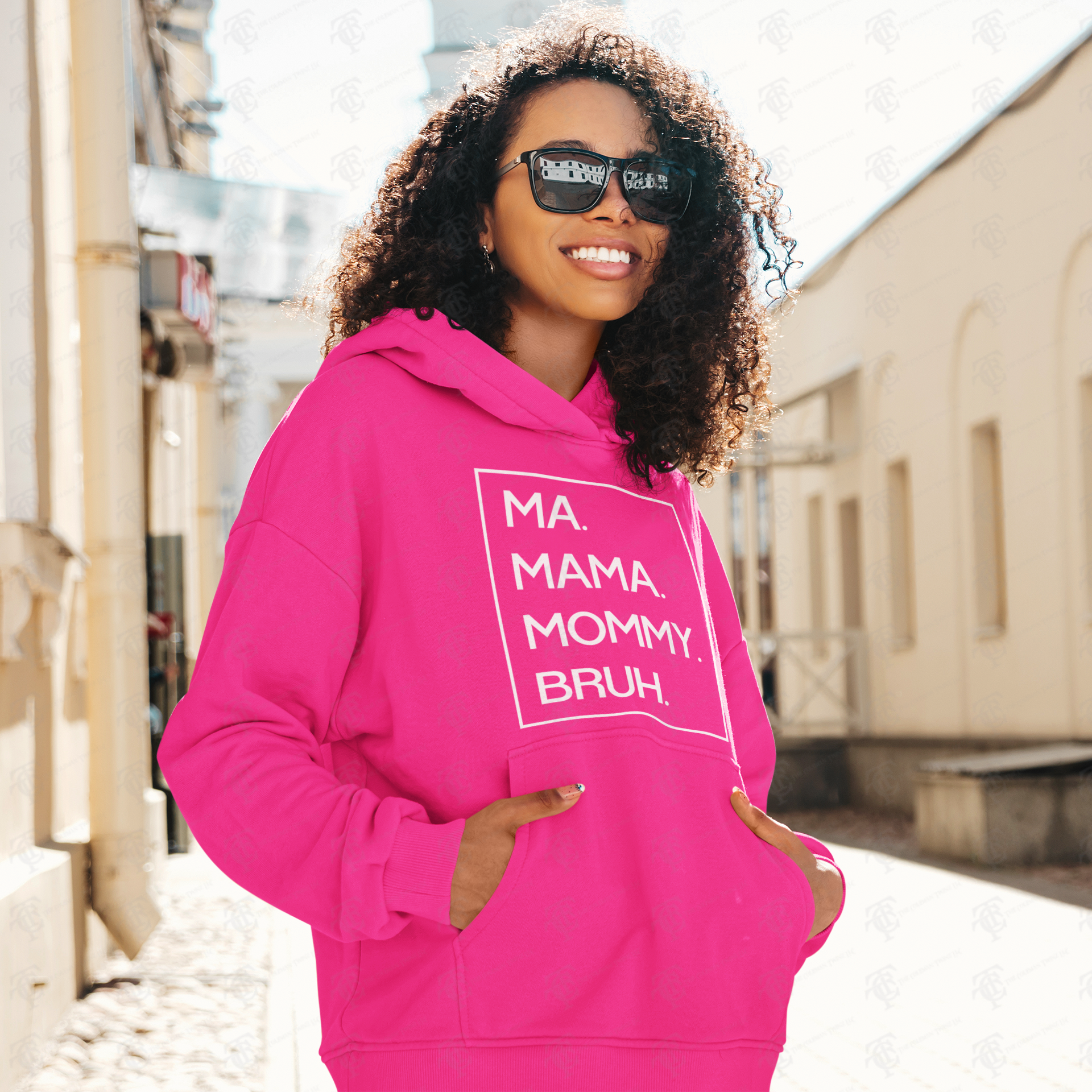 Pink pullover hoodie with front pocket and white “MA MAMA MOMMY BRUH!” graphic