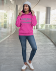 Pink pullover hoodie with front pocket and green slogan lettering