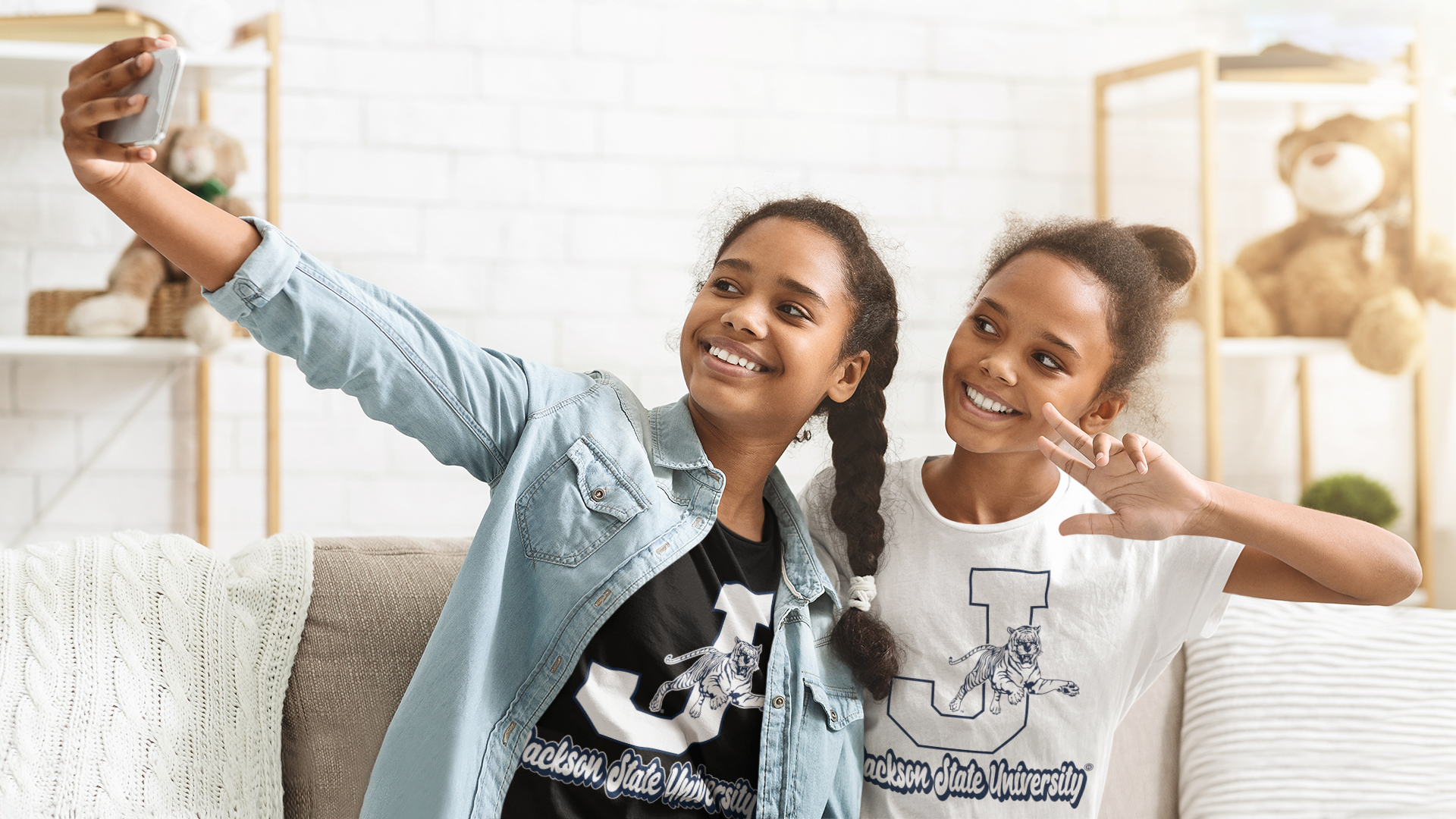 White youth crewneck T-shirt with leaping tiger and large J logo front graphic