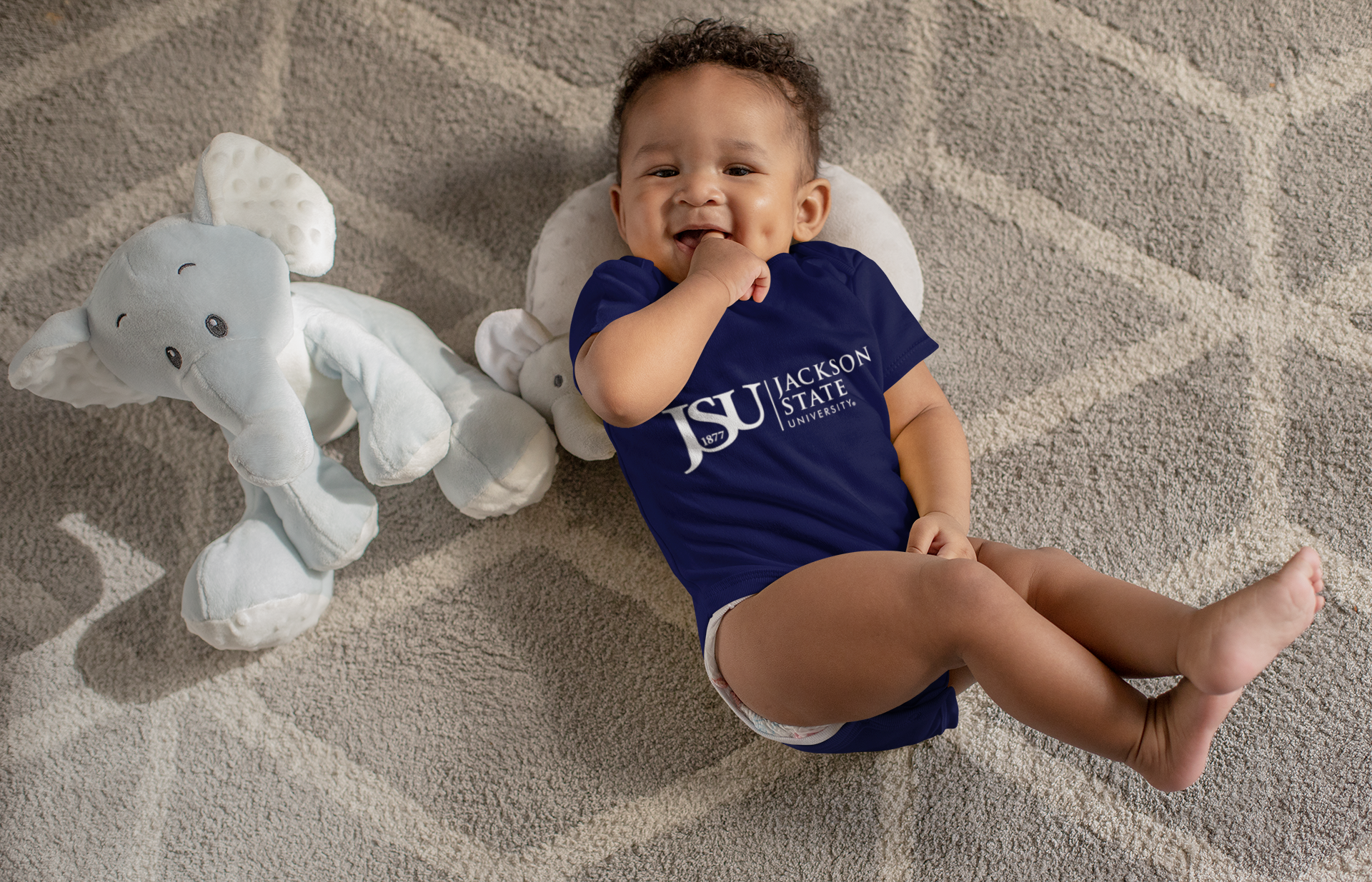 Infant short-sleeve bodysuit in navy with Jackson State logo, worn by baby