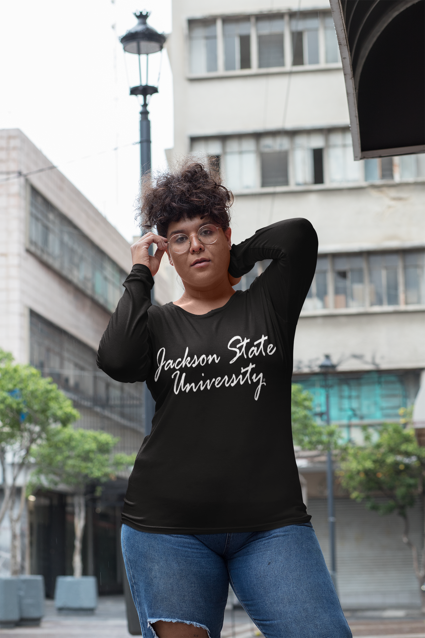 Black long-sleeve crewneck T-shirt with white script logo on chest
