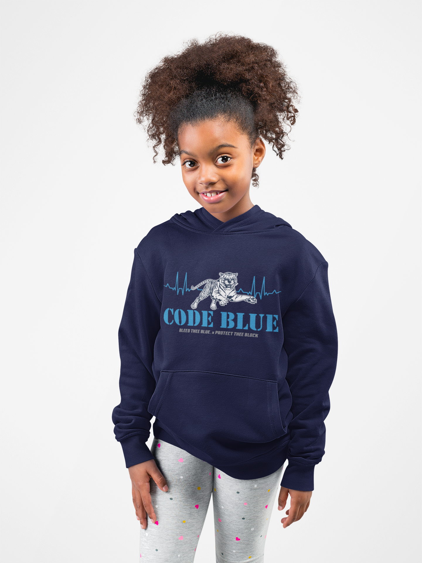 Youth navy hoodie on child, “Code Blue” front graphic, kangaroo pocket visible