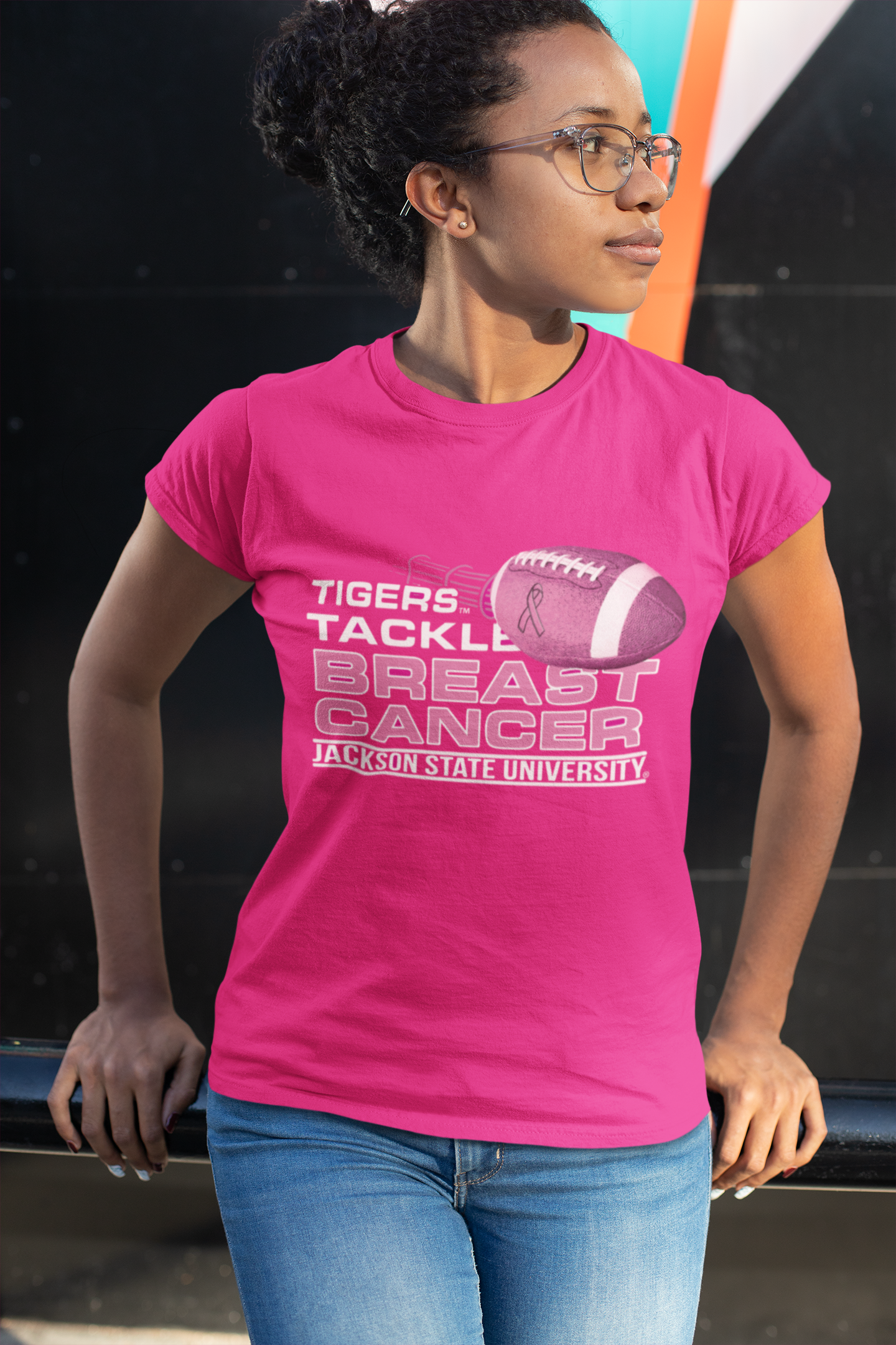 Pink crew-neck T-shirt with “Tigers Tackle Breast Cancer” football chest graphic