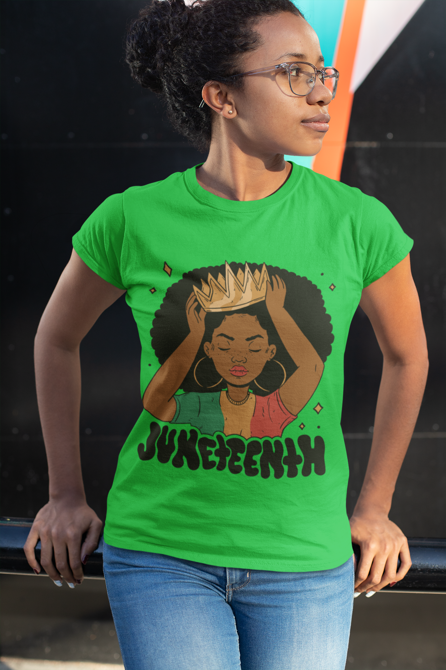 Green Juneteenth Queen T-shirt on model with woman-in-afro hands graphic and Juneteenth text