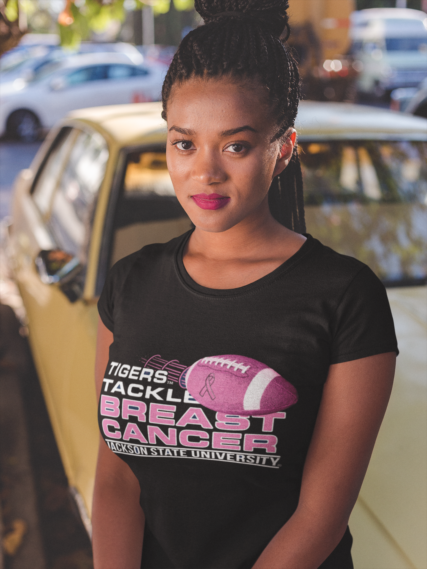 Black crew-neck T-shirt with large “Tigers Tackle Breast Cancer” football graphic