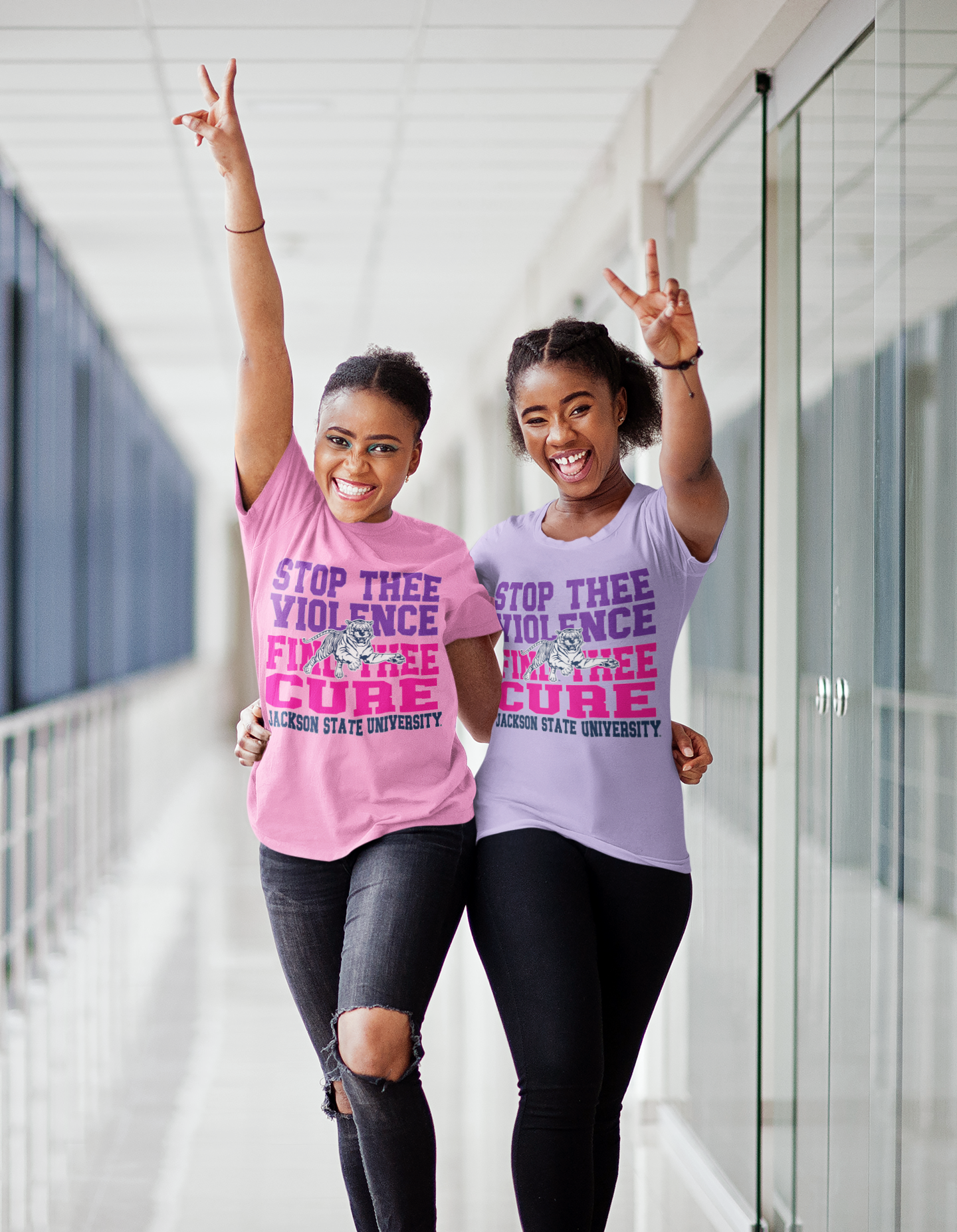 Light pink and lavender unisex crew neck T-shirts with "Stop Thee Violence" and "Cure"