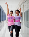 Light pink and lavender unisex crew neck T-shirts with "Stop Thee Violence" and "Cure"