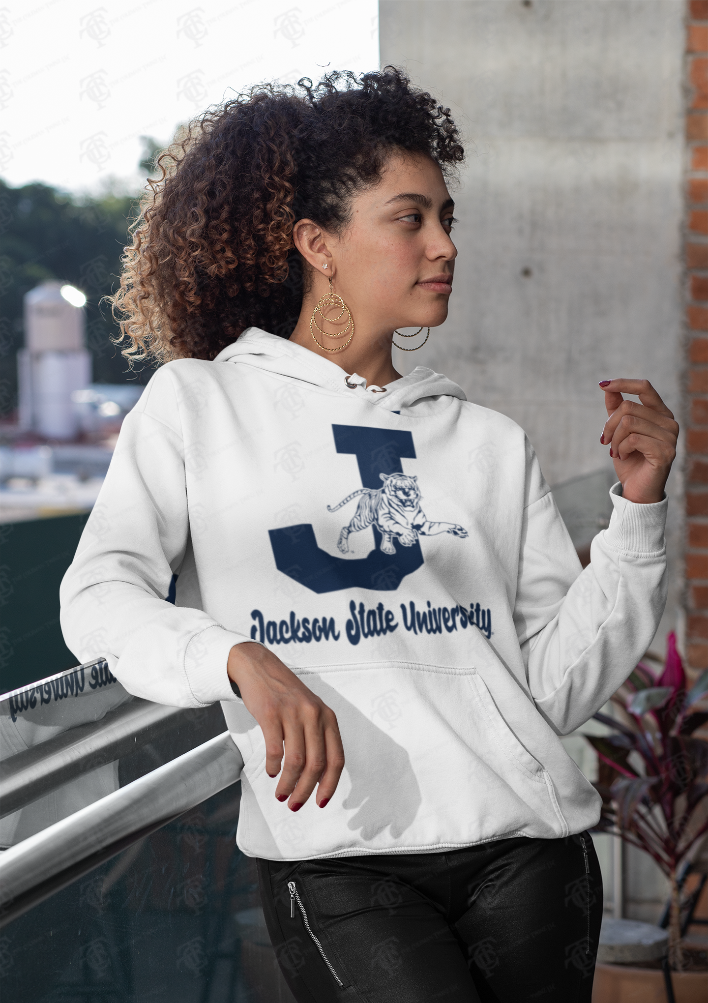 White unisex pullover hoodie with leaping tiger graphic and Jackson State University text