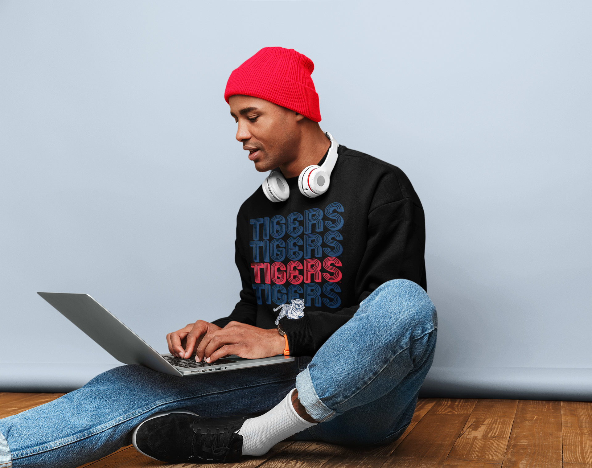 Black crewneck sweatshirt with Tigers retro striped graphic, worn by a person