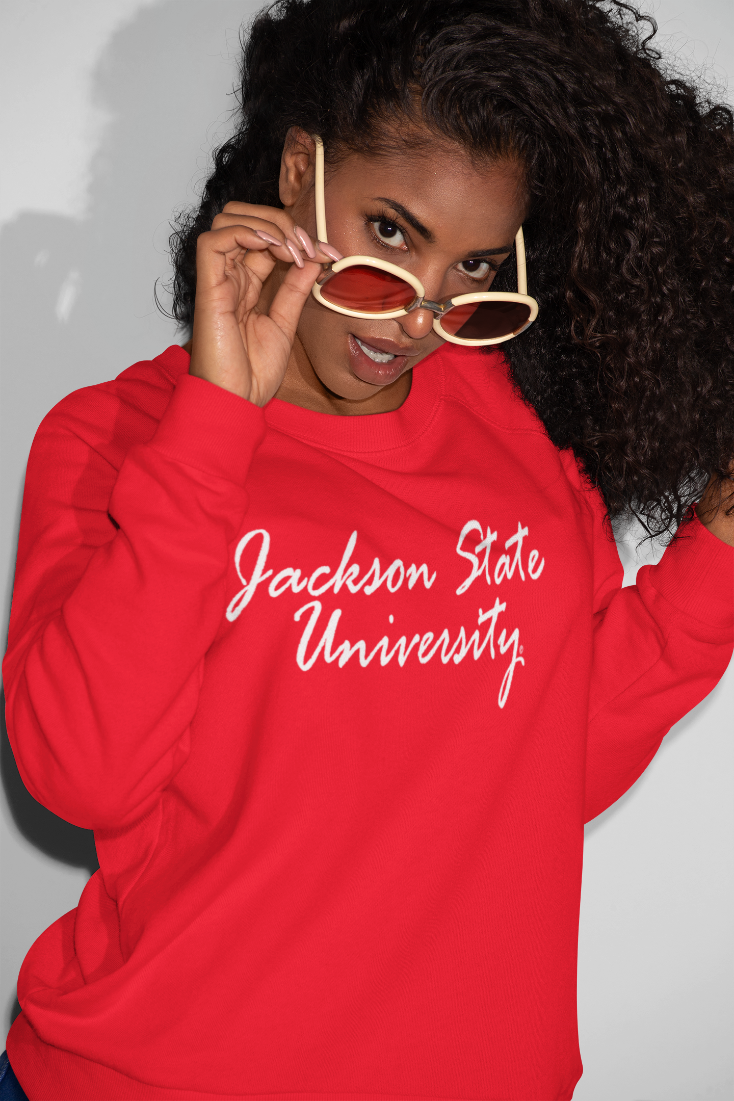 Red unisex sweatshirt with white script university logo