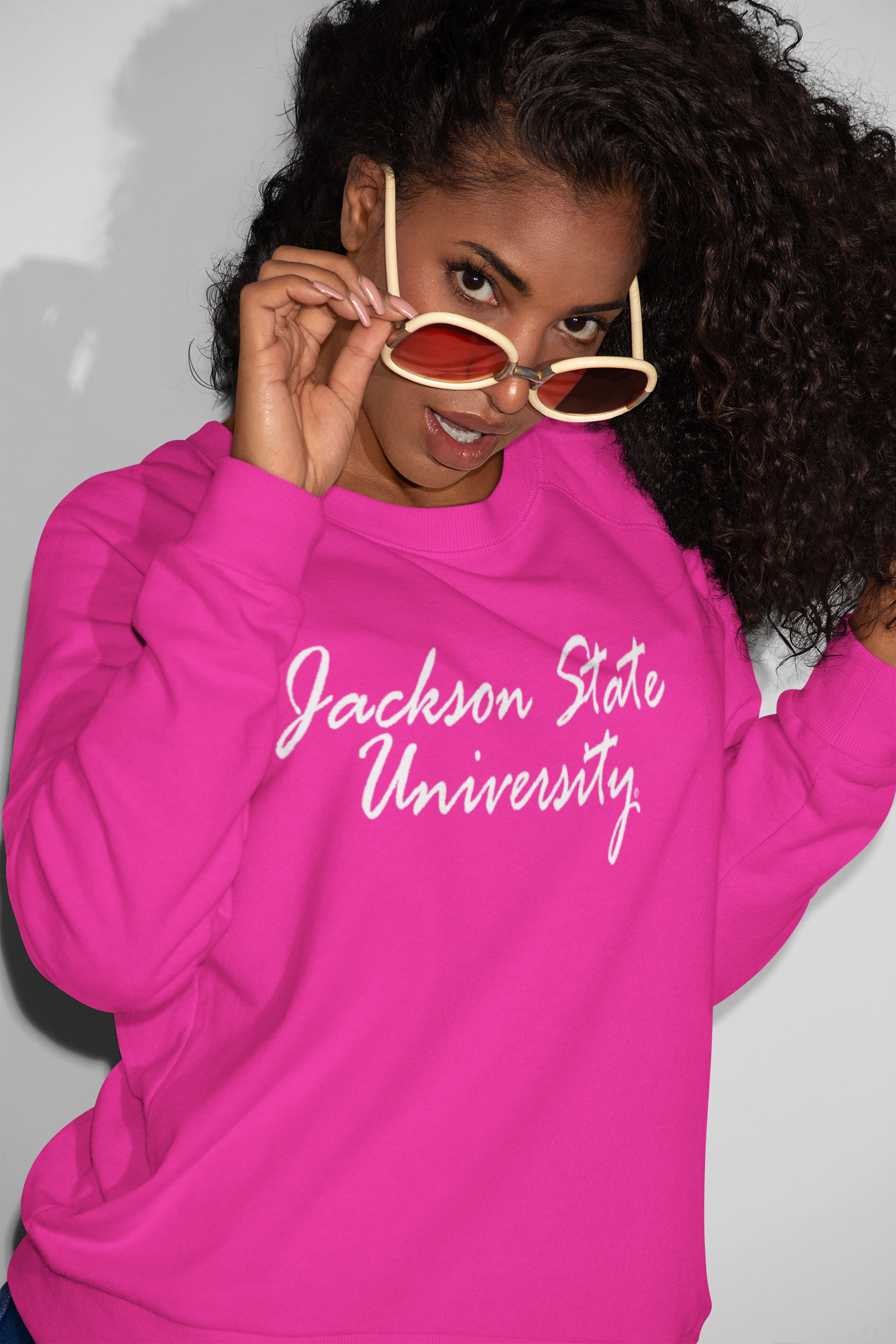 Pink unisex sweatshirt with white script university logo