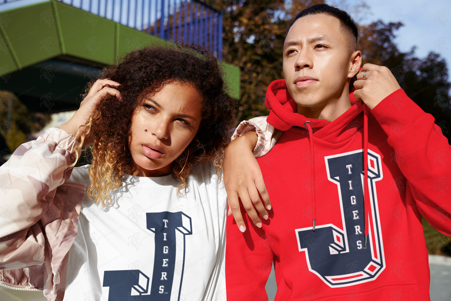 Two-tone view: white and red pullover hoodies with Tigers J front logos