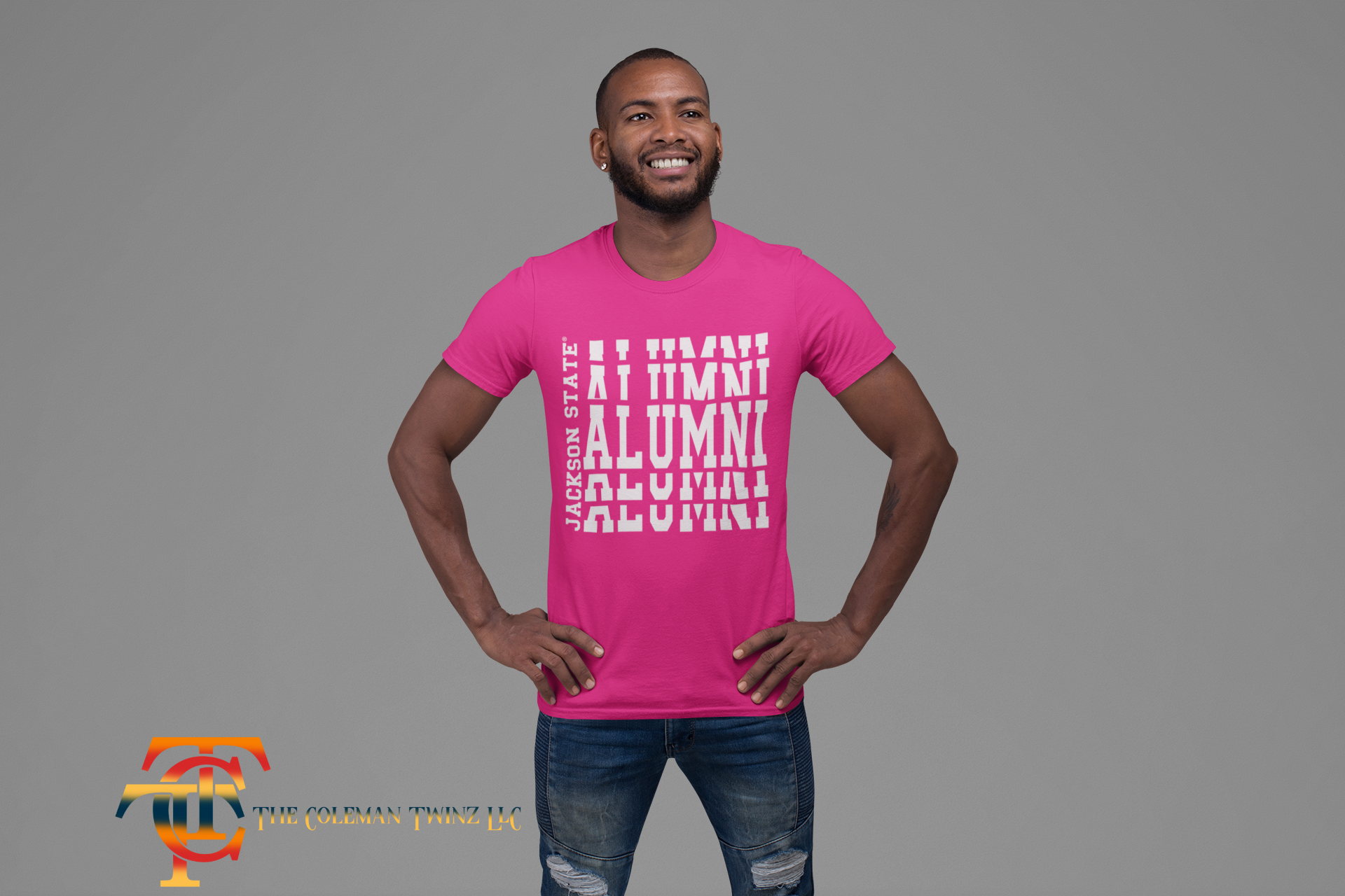 Pink crew-neck short sleeve T-shirt with white stacked “Alumni” graphic on model