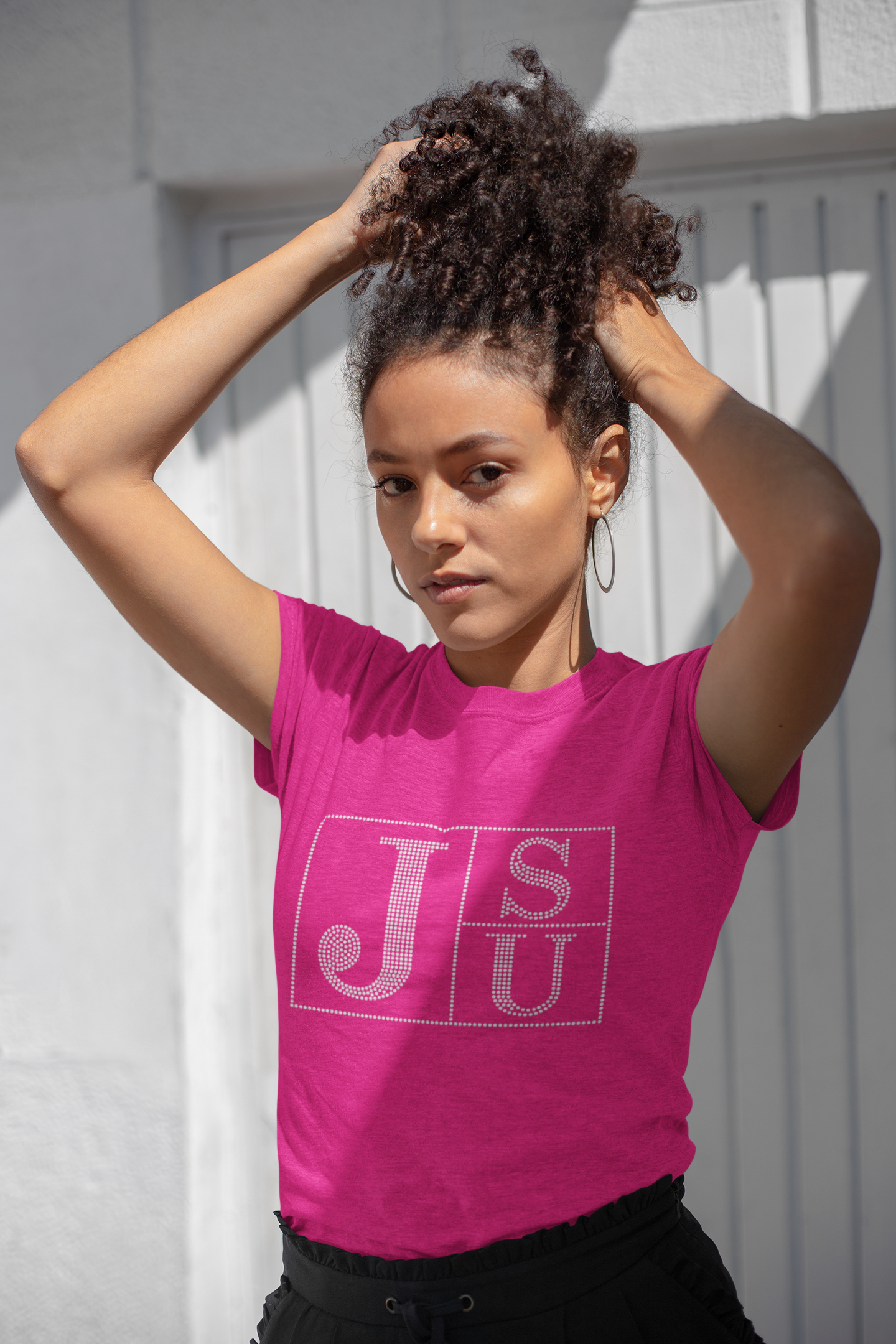 Fuchsia crew-neck T-shirt with rhinestone block TS and JU lettering on chest