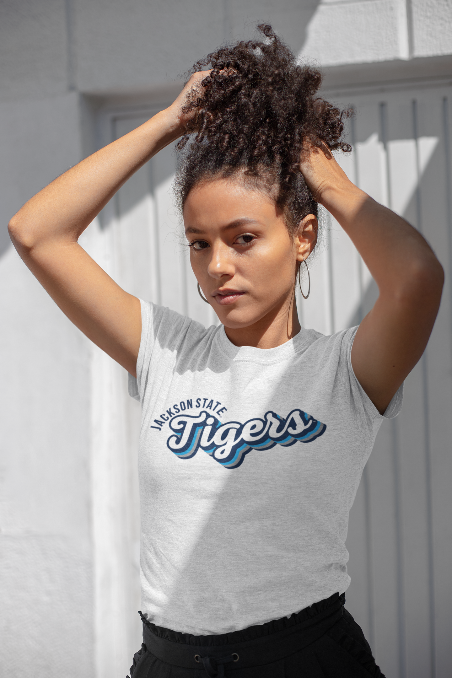 Light heather gray crew-neck T-shirt with retro Tigers team graphic, worn by model