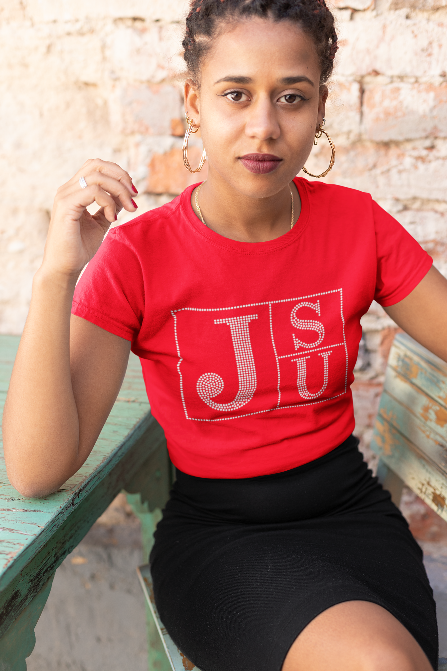 Red crew-neck T-shirt with rhinestone block TS and JU lettering on chest