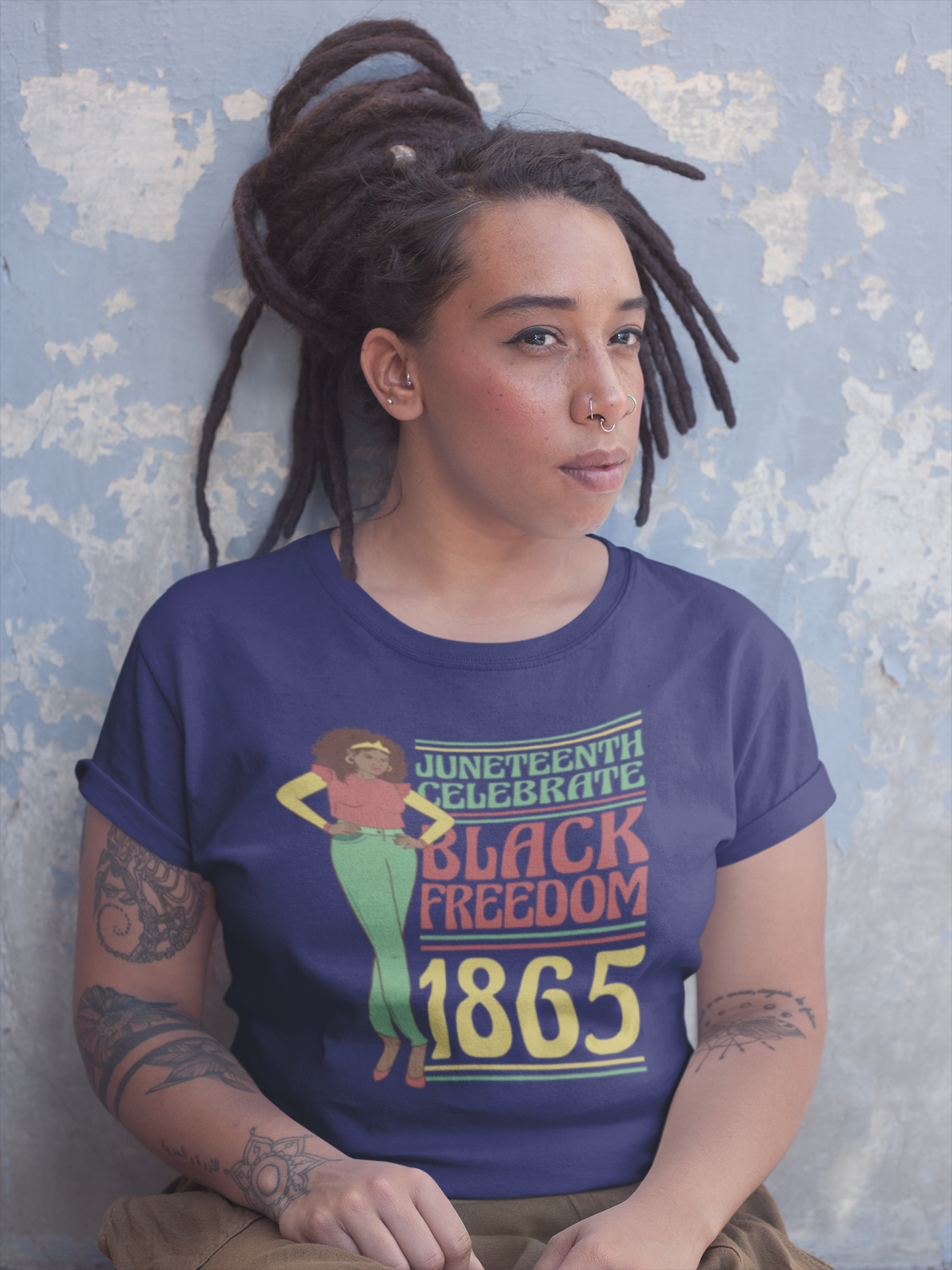 Navy Juneteenth T-shirt worn by woman; 'Black Freedom 1865' front graphic