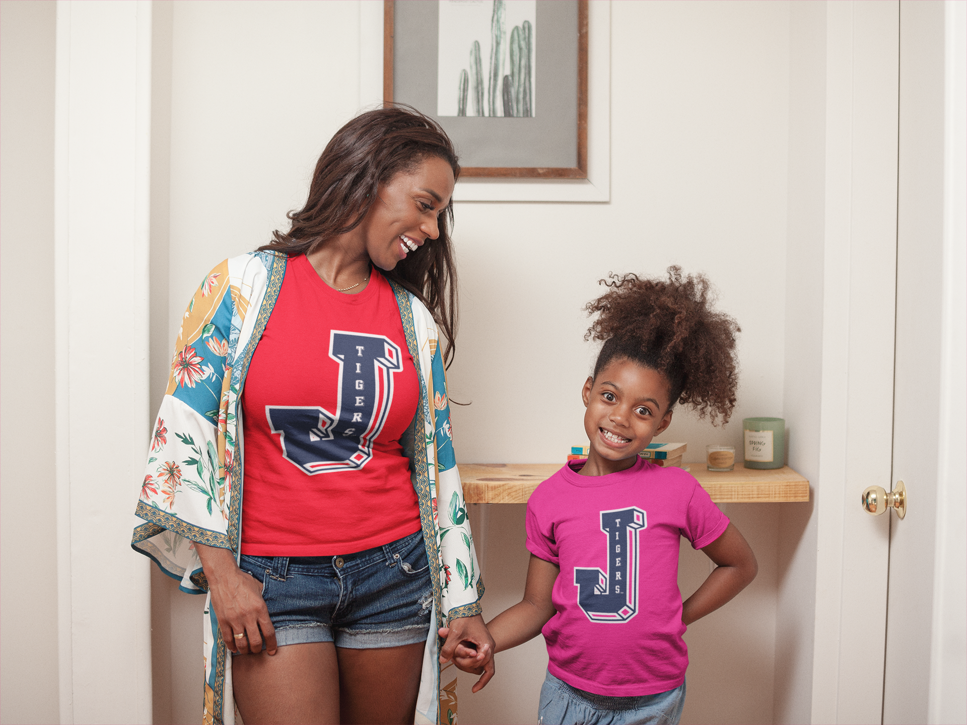 Toddler wearing red crewneck T-shirt with Tigers J logo graphic on chest