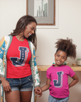 Toddler wearing red crewneck T-shirt with Tigers J logo graphic on chest