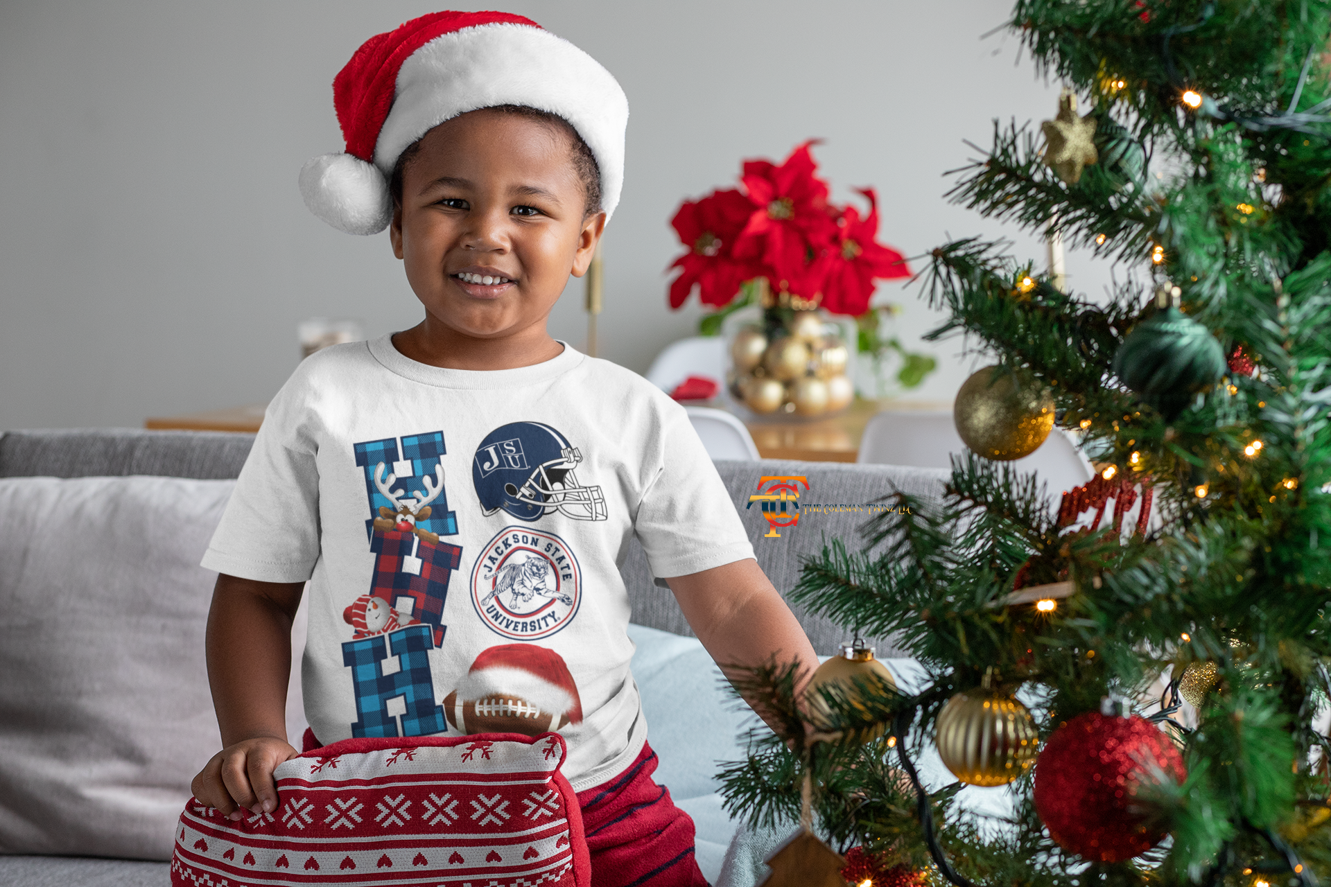 Toddler wearing white crew neck T-shirt with Jackson State helmet and football graphic