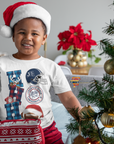 Toddler wearing white crew neck T-shirt with Jackson State helmet and football graphic