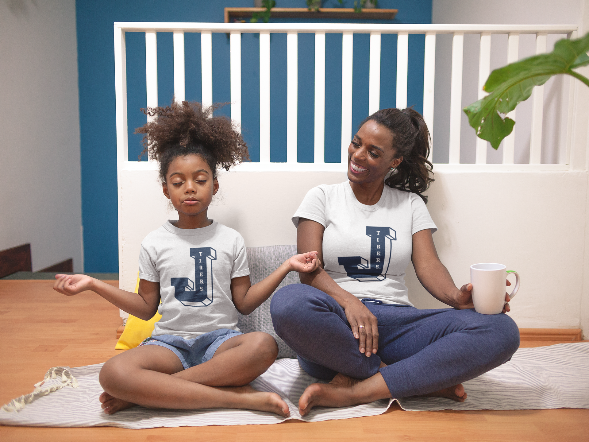 Two toddlers wearing white crewneck T-shirts with Tigers J logo graphic
