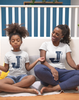 Two toddlers wearing white crewneck T-shirts with Tigers J logo graphic