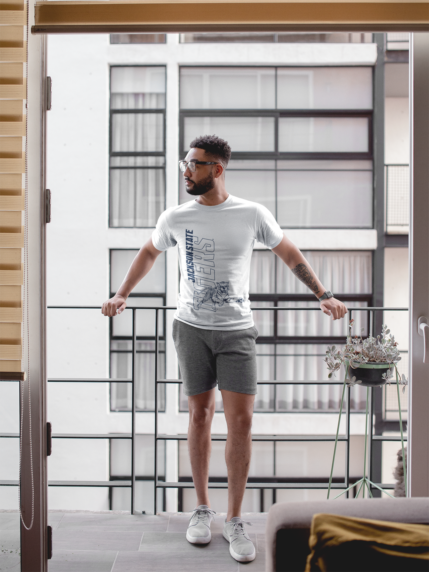 Unisex crewneck T-shirt in athletic heather gray with leaping tiger graphic and large text