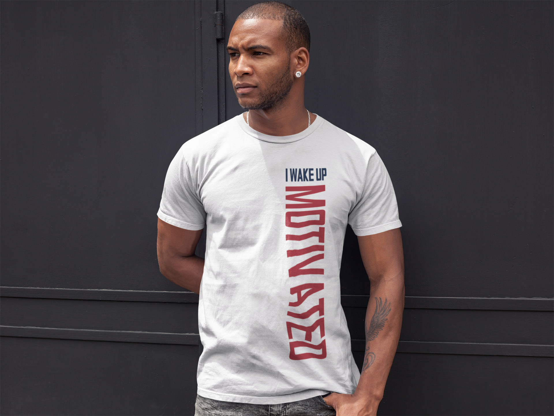 White crew-neck T-shirt with vertical red 'MOTIVATED' text and 'I WAKE UP'