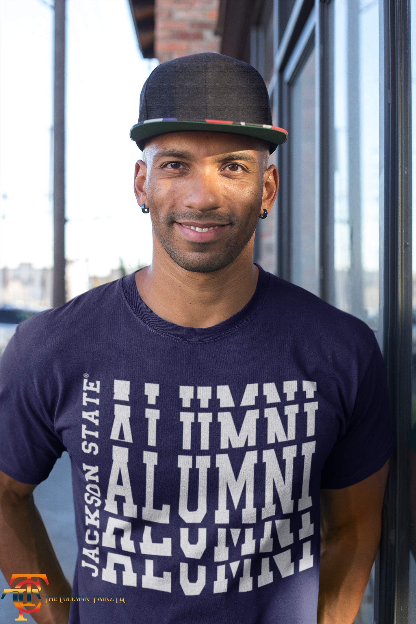 Navy crew-neck short sleeve T-shirt with white stacked “Alumni” graphic on model