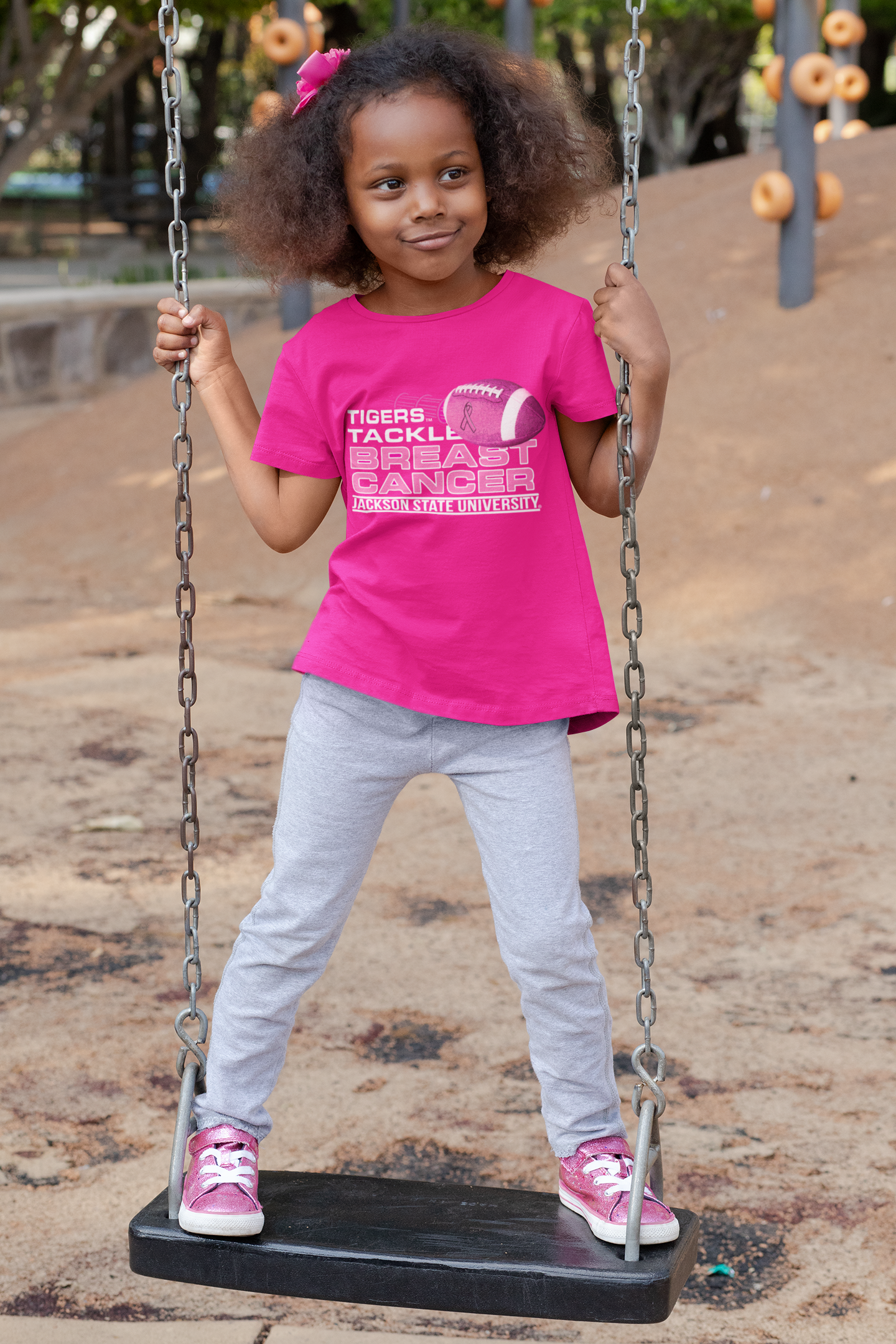 Toddler pink T-shirt with football 'Tigers Tackle Breast Cancer' logo, front view