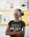 Black crew neck short sleeve T-shirt worn by a child with 'BLACK & Educated' text logo.