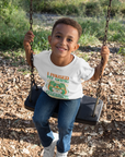 White kids T-shirt with “I Paused My Game To Celebrate Juneteenth” front graphic