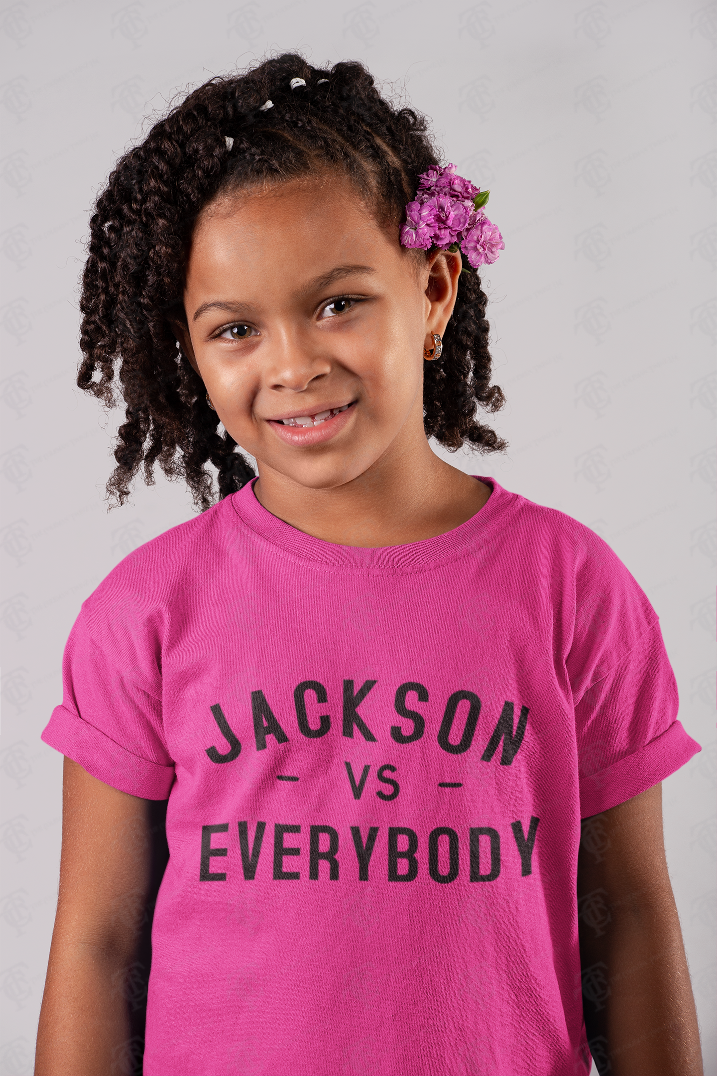 Youth crewneck T-shirt, bright pink with “Jackson vs Everybody” in dark lettering