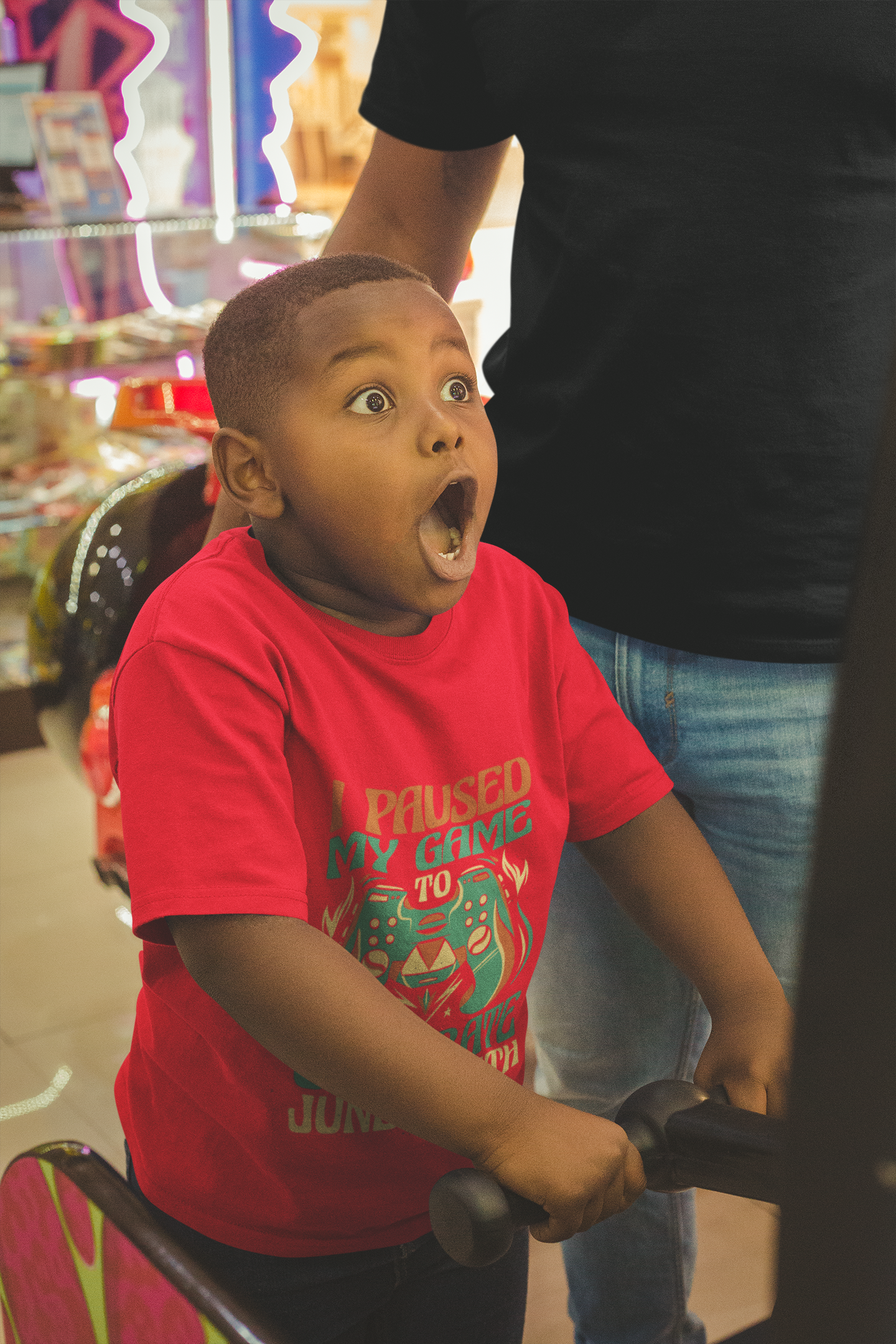 Red kids T-shirt with “I Paused My Game To Celebrate Juneteenth” front graphic
