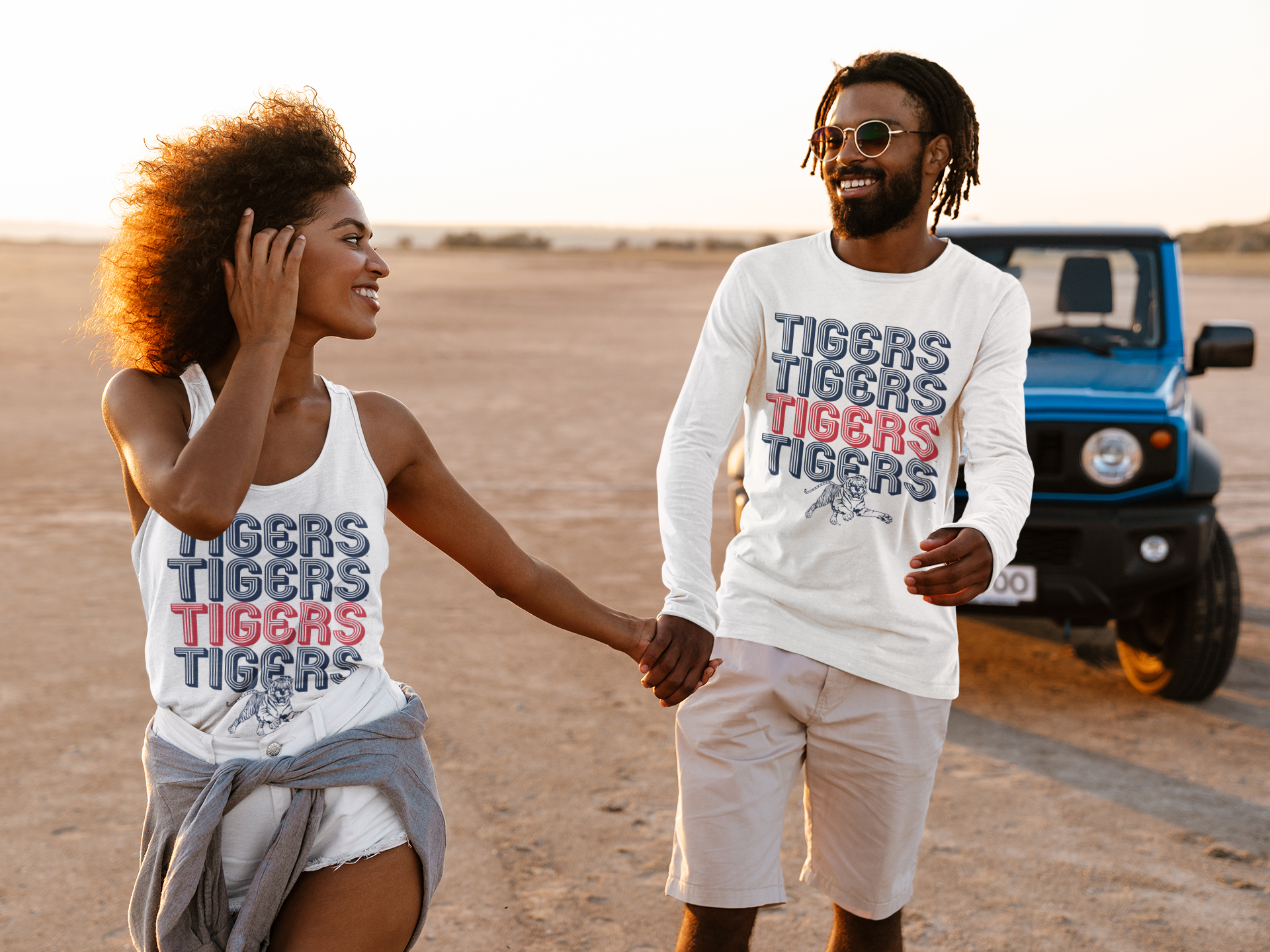 White long-sleeve crewneck T-shirt with stacked Tigers text and tiger mascot graphic
