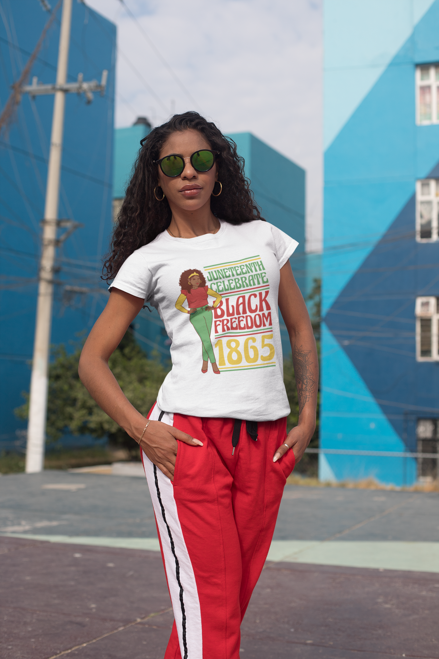 White Juneteenth T-shirt worn by woman; 'Black Freedom 1865' front graphic