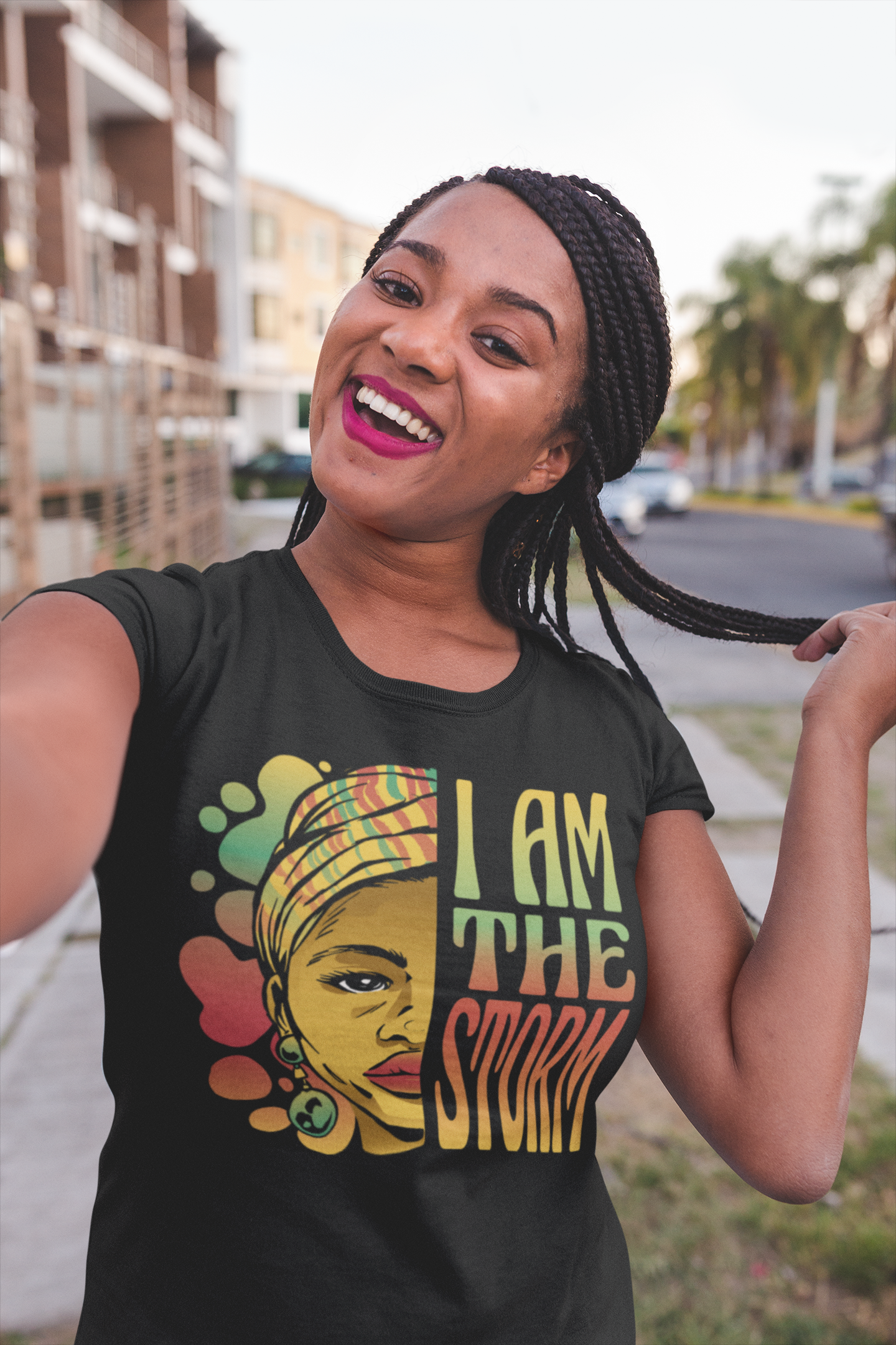 Black short-sleeve T-shirt with front portrait graphic and “I AM THE STORM” text