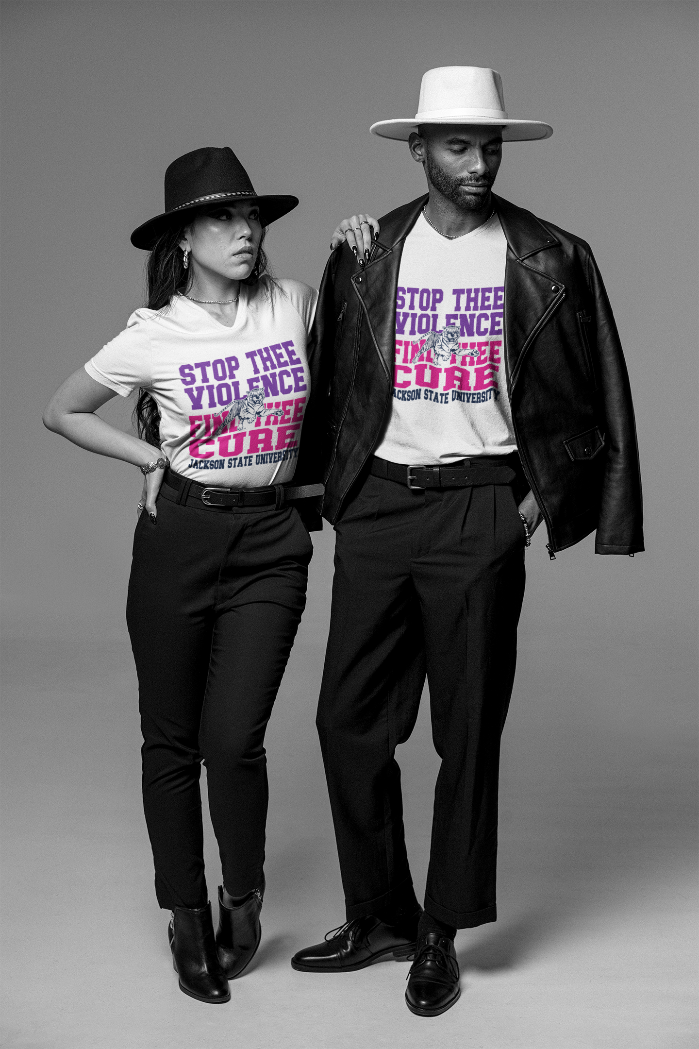 Black v-neck T-shirt with large "Stop the Violence" front graphic worn by model