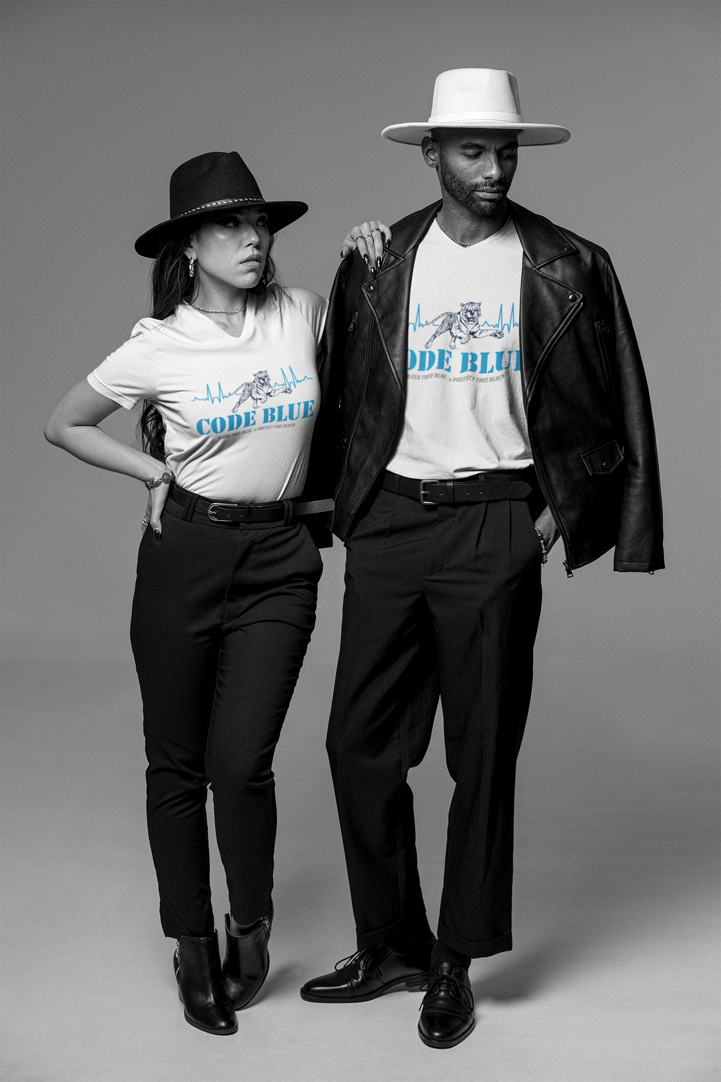 Unisex V-neck t-shirt with “Code Blue” graphic, worn in dark and white by models.